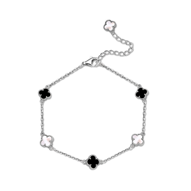 A silver bracelet featuring clover shaped charms