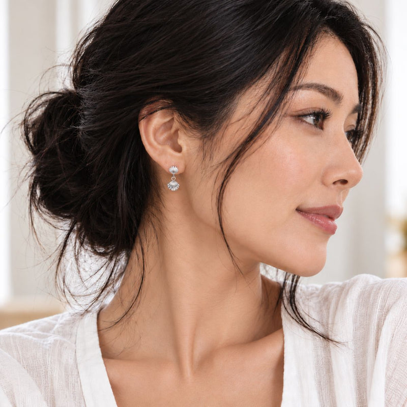 Delicate Seashell Earrings worn by a model