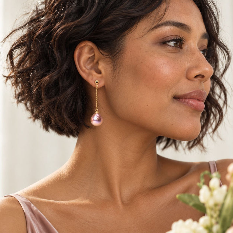 bridesmaid wearing baroque purple pearl earrings