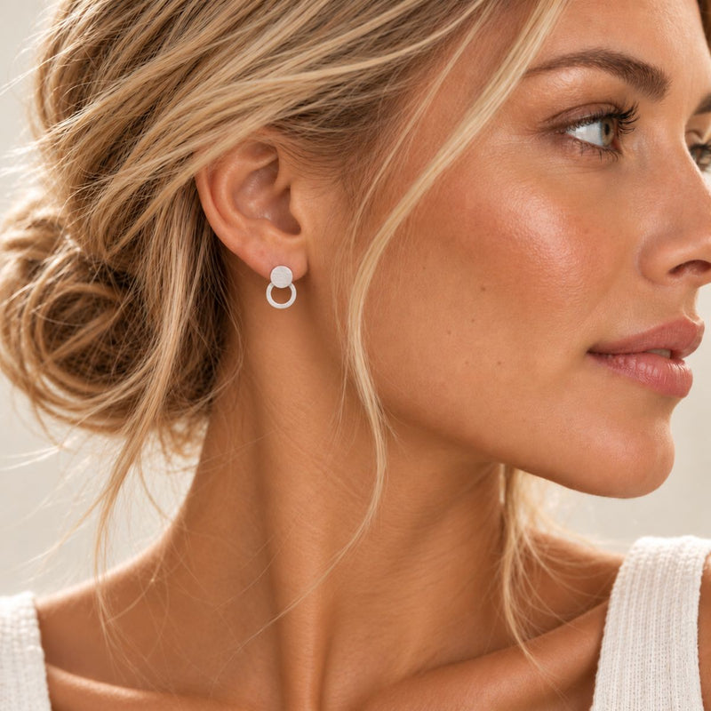 Elegant Silver Hoop Earring worn by a blonde model