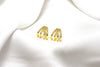 A pair of gold-colored butterfly earrings with a vermeil coating on a white background