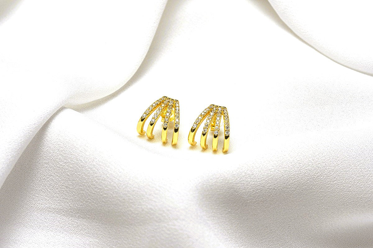 A pair of gold-colored butterfly earrings with a vermeil coating on a white background
