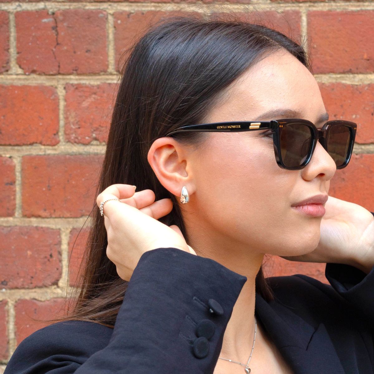 Woman wearing sterling silver chunky earrings