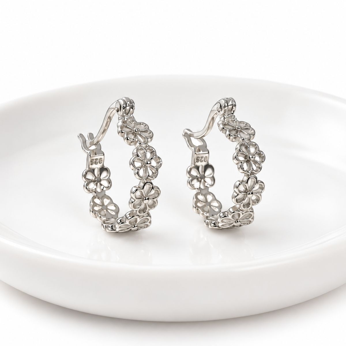 FloralSilverHoopEarringsonWhiteDish