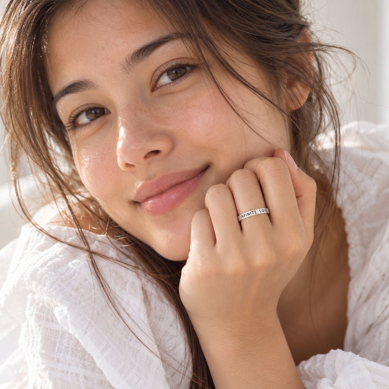 innocent looking model wearing infinite love ring 