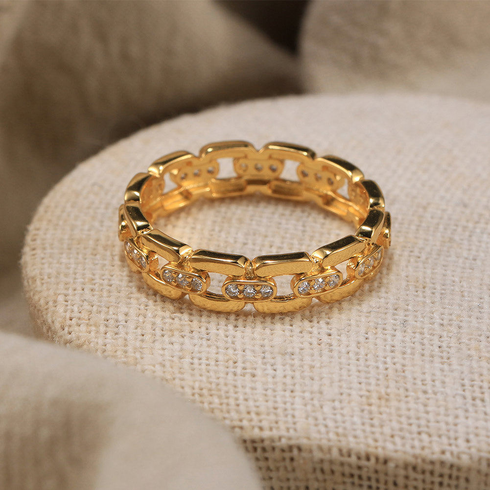 Gold Vermeil ring with diamond accents on a textured beige surface