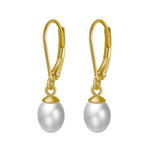 Load image into Gallery viewer, A pair of leverback pearl earrings with a  gold vermeil coating on a white background.
