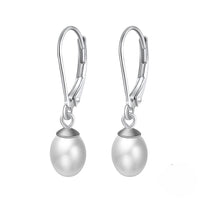 A pair of silver leverback pearl earrings on a white background.