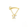 Gold butterfly-shaped earring on a white background