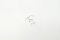 A close-up image of a sterling silver nose stud with an L-shaped hook, showing the texture of the silver and the slight sheen.