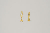 A pair of gold vermeil hoop earrings with a starfish and shell dangle, displayed against a plain background.