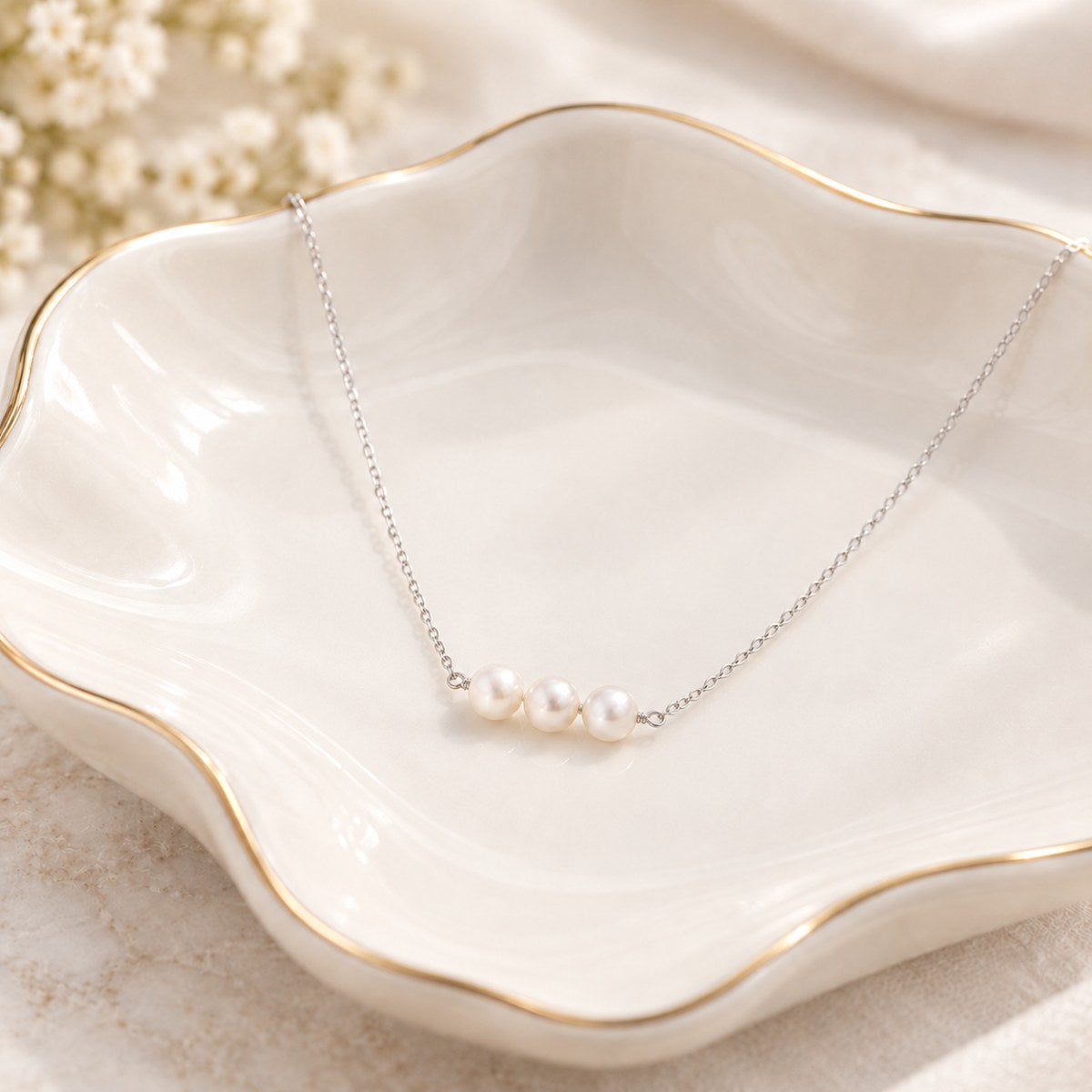 trilogy in silver on jewellery dish