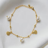A sterling silver gold vermeil bracelet with freshwater pearl and shell-shaped silver elements