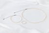 A set of elegant pearl jewellery, ring, necklace and bracelet all matching on a white background.