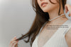 A white 6 mm pearl choker necklace with a sterling silver chain