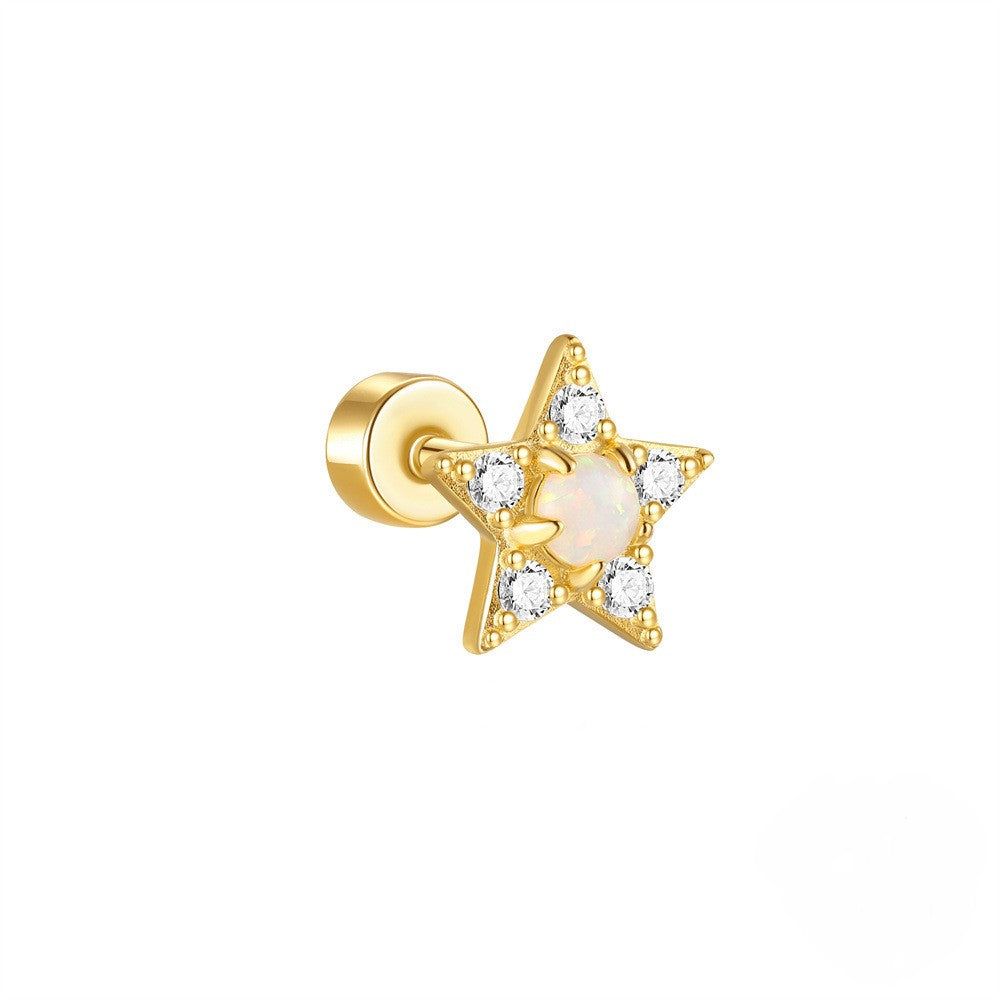 Gold star-shaped earring with a central pearl and diamond-like stones on a white background