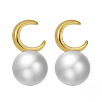 Pearl earrings with gold vermeil moon shape on a white background
