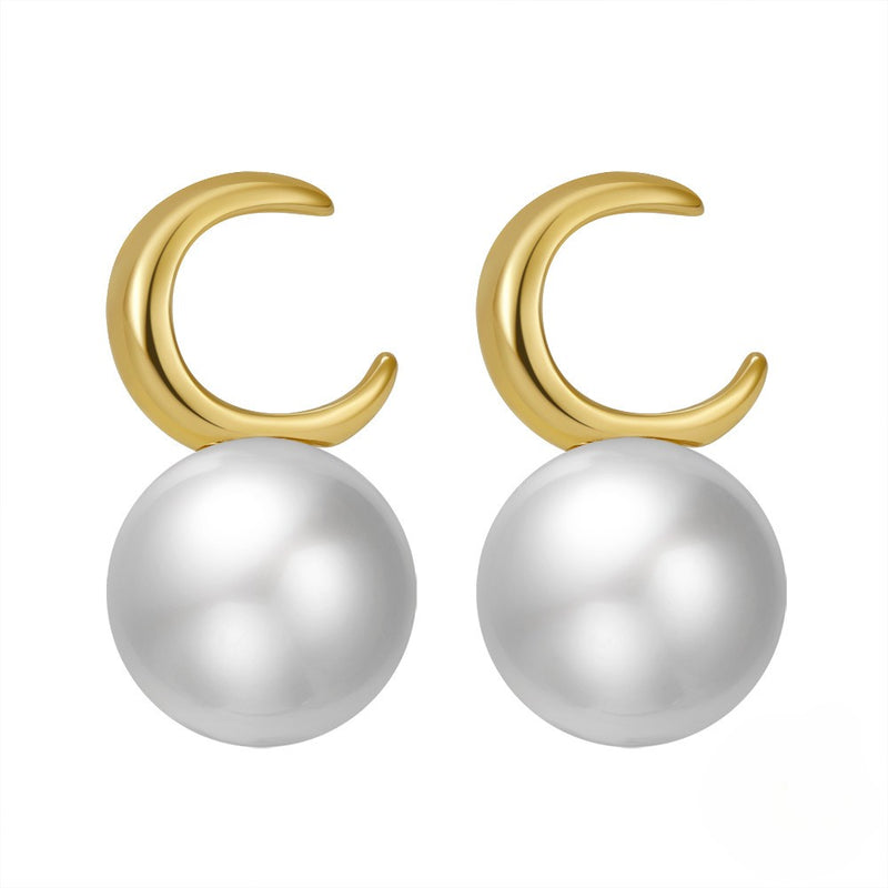Pearl earrings with gold vermeil moon shape on a white background