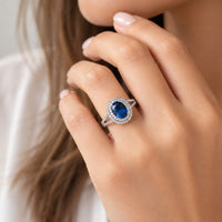 Blue stone ring on a model's finger