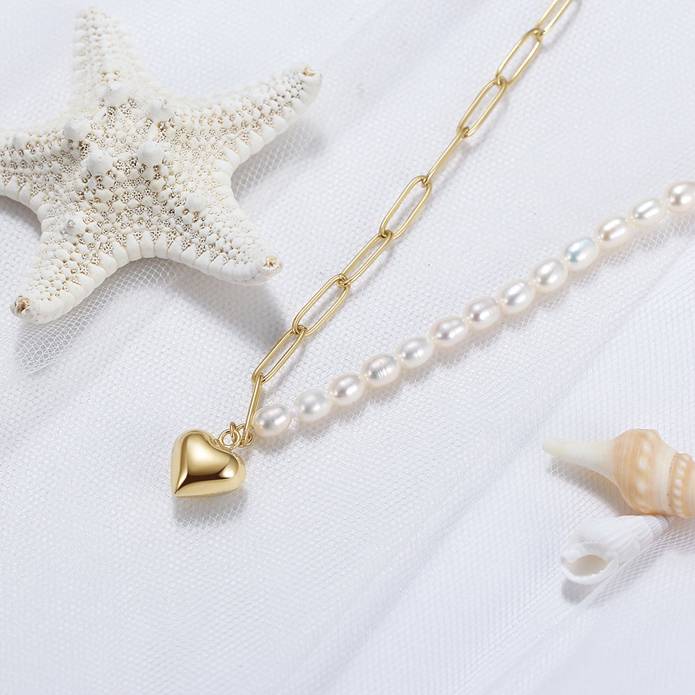 Pearl necklace gold vermeil with a gold heart pendant on a white background 
