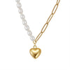 Necklace with freshwater pearl and a gold heart pendant on a white background