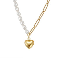 Necklace with freshwater pearl and a gold heart pendant on a white background