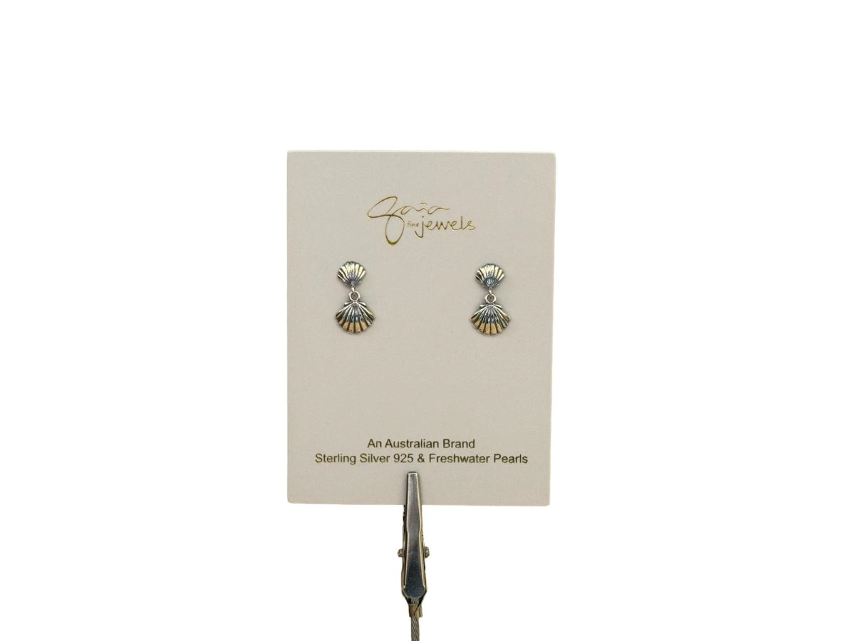 Shall shaped stud earrings on a display card white background