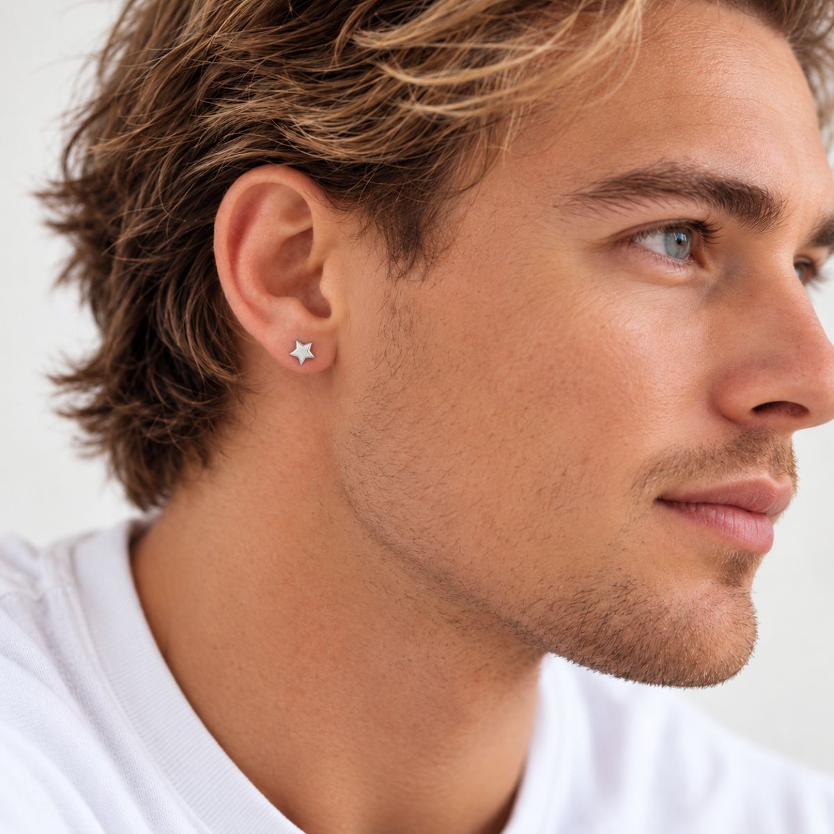 Silver Star Earrings worn by a model