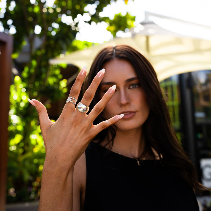 Woman wearing a solid chunky bold sterling silver ring