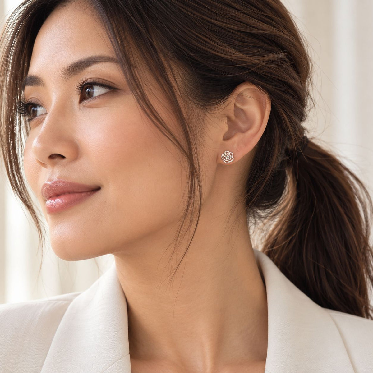 Sterling Silver Rose Stud Earrings worn by a model