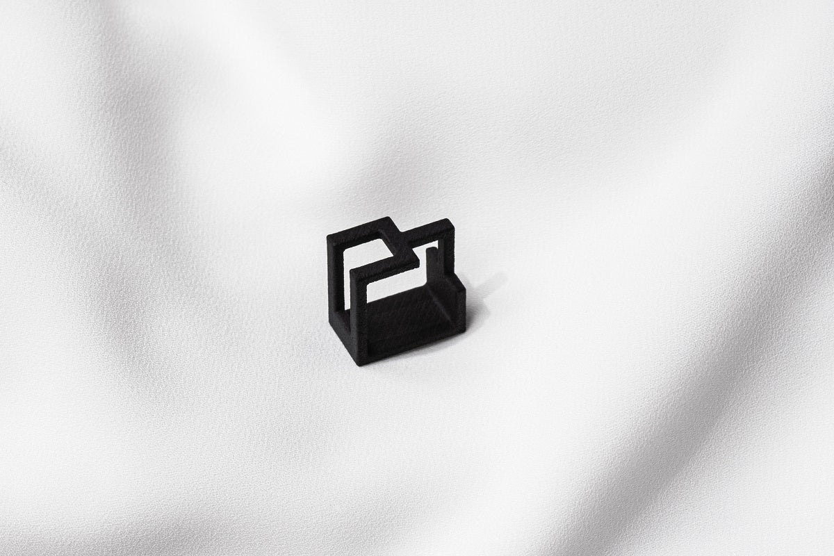 A matte black ring with a minimalist design, 3D printed from sustainable PA12 nylon, displayed on a white background.