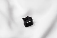 A matte black ring with a minimalist design, 3D printed from sustainable PA12 nylon, displayed on a white background.