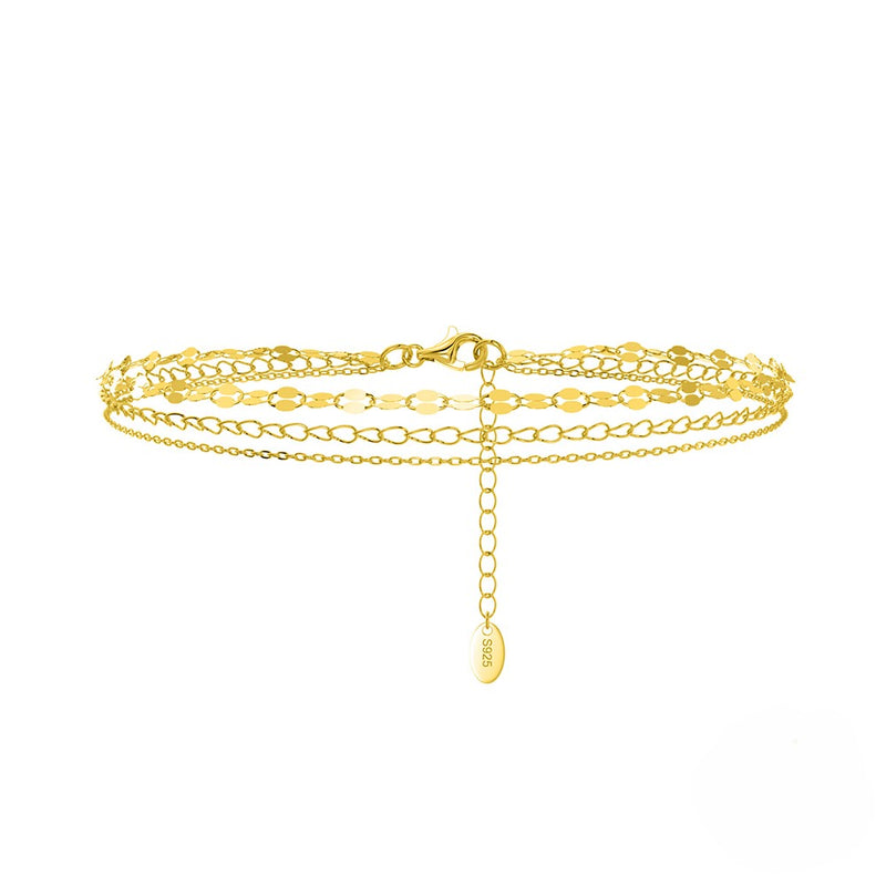 A gold vermeil anklet with 3 bands ona  white background