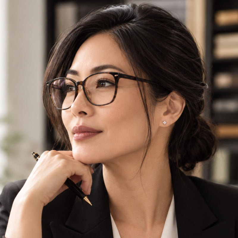 executive wearing sterling stud cubic earrings
