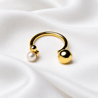gold vermeil invisible pearl ring on white cloth background