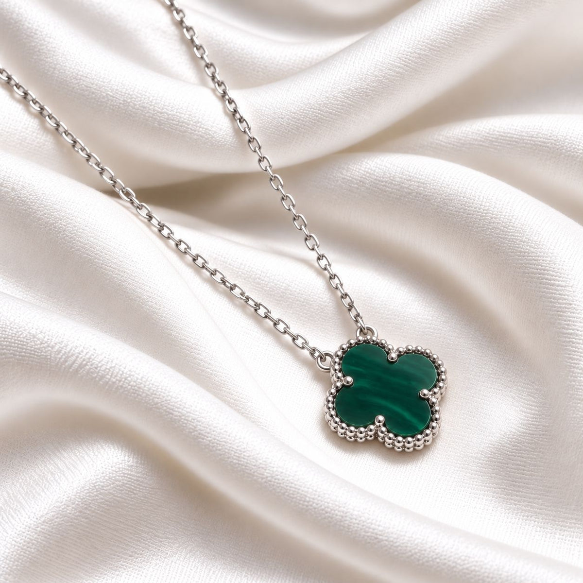 green clover on sterling silver