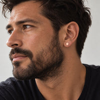 rose gold vermeil sterling silver stud worn by a man