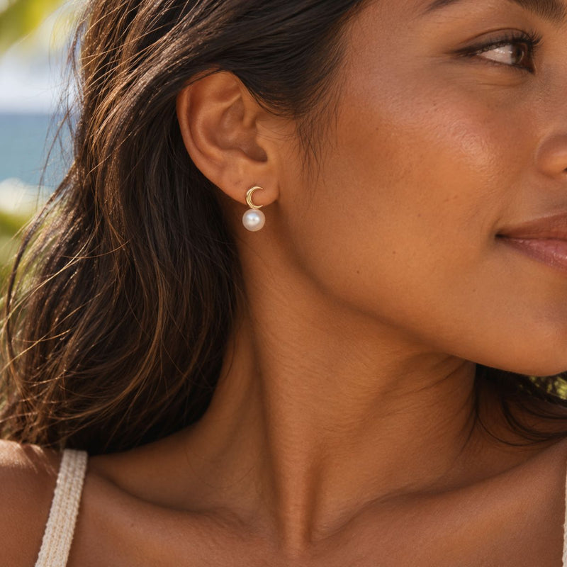 model wearing sailor moon earrings