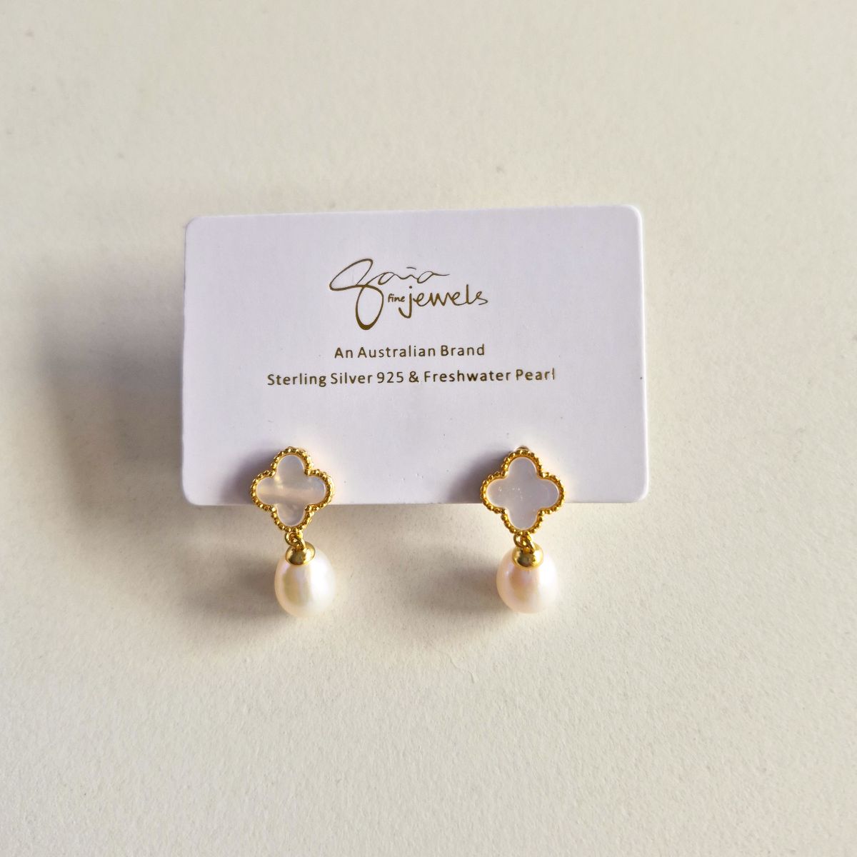 white clover white drop pearl earrings on gaia fine jewels earrings card