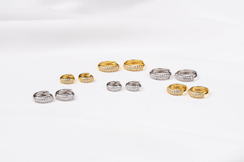 A collection of huggies sterling silver 925 hoop earrings and gold vermeil with cubic zirconia stone with different sizes.