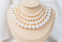 A white pearl choker necklace with a sterling silver chain, displayed on a necklace display stand