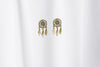 A pair of gold vermeil dreamcatcher stud earrings with butterfly backs, displayed against a white background.