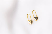 A pair of gold heart lock shaped earrings on a white background