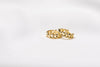 A pair of interlinked gold vermeil hoop earrings on a white background, showcasing a patterned design.