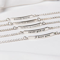 Five sterling silver bracelets with inscriptions, displayed on a white surface.