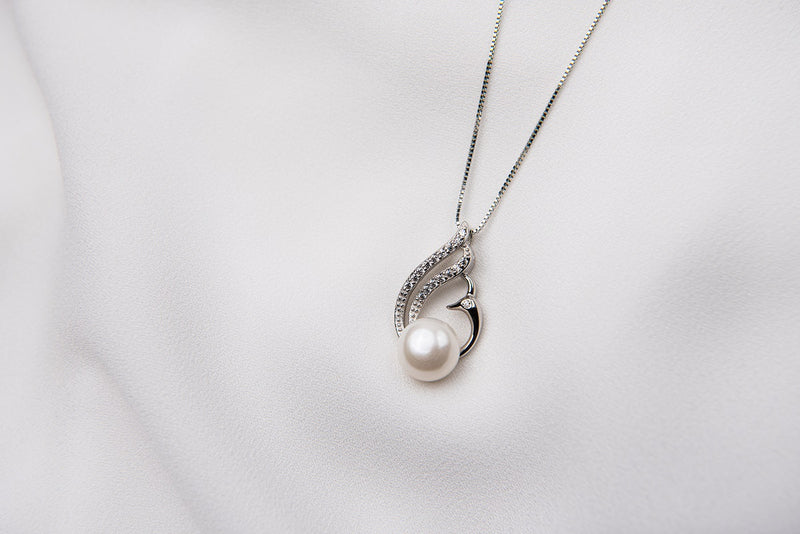 A freshwater pearl necklace with cubic zirconia stone displayed on a white background.