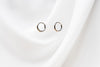 A collection of plain huggie earrings in sterling silver, displayed in various sizes with the diameters marked.
