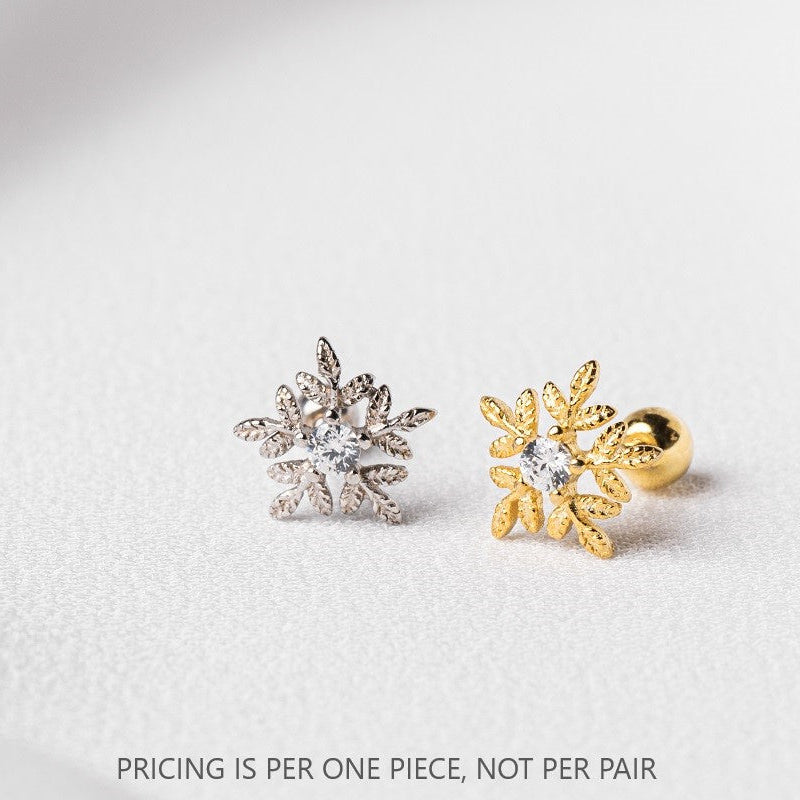 A single gold and silver snowflake-shaped stud earring with a clear, sparkling stone in the center, displayed against a white background with the text 'PRICING IS PER ONE PIECE, NOT PER PAIR'.