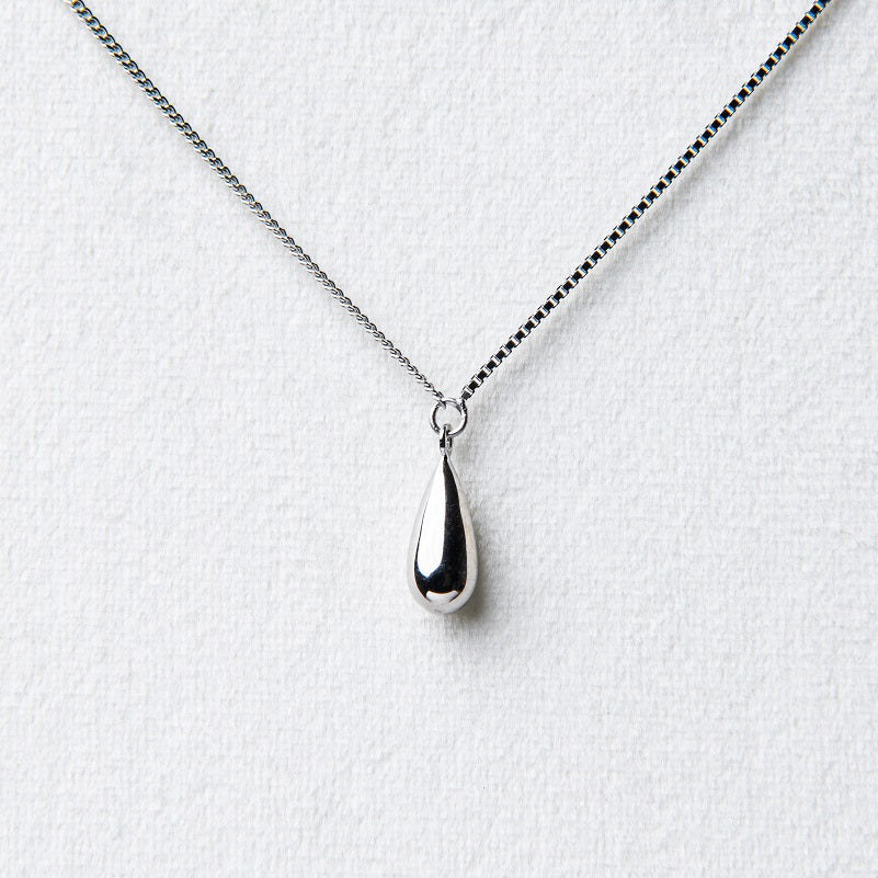 A sterling silver necklace with a chain link design and a single drop pendant.