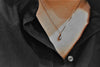 A sterling silver necklace with a chain link design and a single drop pendant.